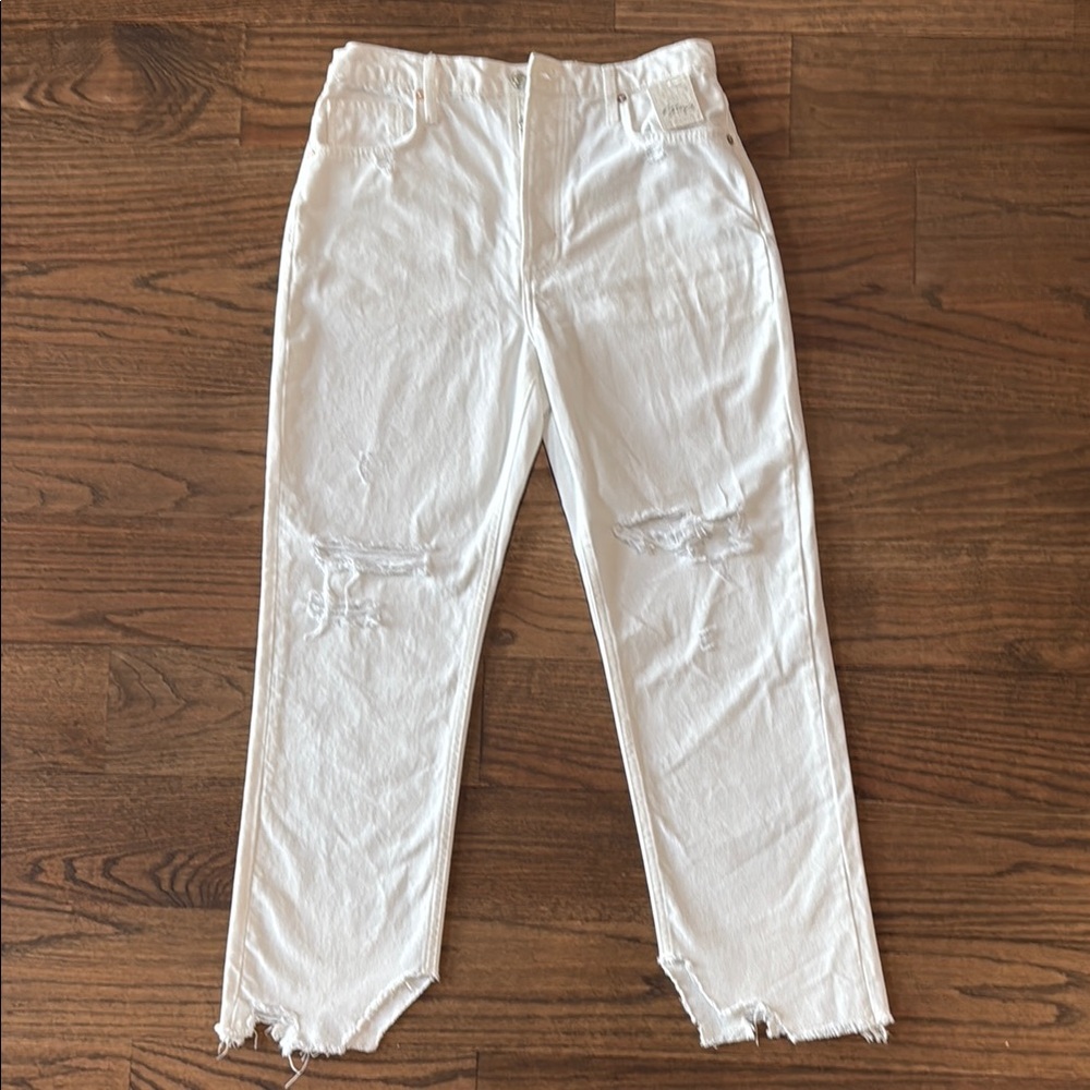 Free People White Distressed Button Fly Jeans.